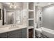 Bright bathroom featuring sleek subway tiles in the shower and decorative tile flooring that enhances the modern look at 1051 S York St, Denver, CO 80209