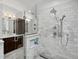 Beautifully designed bathroom with a walk-in shower, sleek vanities, and elegant marble finishes at 1051 S York St, Denver, CO 80209