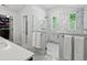 Luxurious bathroom featuring a glass shower with marble tile and modern fixtures, offering a spa-like experience at 1051 S York St, Denver, CO 80209