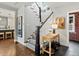 Inviting hallway with a staircase and stylish decor, leading to other rooms in the house at 1051 S York St, Denver, CO 80209