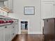 Bright kitchen with stainless steel appliances and white cabinets, including a charming play area at 1051 S York St, Denver, CO 80209