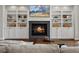 Elegant living room featuring a fireplace, built-in bookshelves, and a comfortable seating area at 1051 S York St, Denver, CO 80209