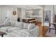 Cozy open-concept living space featuring comfortable seating and stylish views of the kitchen at 1051 S York St, Denver, CO 80209