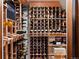 Climate controlled wine cellar with extensive wooden wine racks displaying a variety of bottles at 1051 S York St, Denver, CO 80209