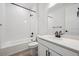 Stylish bathroom features black fixtures, white subway tiles, a tub, and a white vanity with quartz countertop at 1121 Joseph Pl, Erie, CO 80026