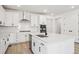 Modern kitchen featuring white cabinets, an island with seating, and stainless steel appliances at 1121 Joseph Pl, Erie, CO 80026