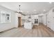 Open-concept kitchen features a large island, stainless steel appliances, and hardwood floors at 1121 Joseph Pl, Erie, CO 80026