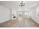 Open-concept living room features a modern fireplace, recessed lighting, and patio access at 1121 Joseph Pl, Erie, CO 80026