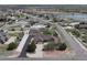 Neighborhood aerial view showcasing home with large yard, separate garage, and surrounding residential area at 16350 Timber Cove St, Hudson, CO 80642