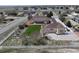 Home aerial view showcasing yard, patio, detached garage, and surrounding neighborhood at 16350 Timber Cove St, Hudson, CO 80642