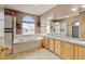 Bathroom with a tub and separate shower, along with ample vanity space at 16350 Timber Cove St, Hudson, CO 80642