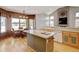 Kitchen features hardwood floors, spacious counters, white appliances, and a breakfast nook at 16350 Timber Cove St, Hudson, CO 80642