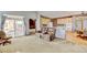 Open-concept living area with kitchen, dining, and sliding doors to the patio at 16350 Timber Cove St, Hudson, CO 80642