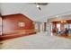 Open layout of living room and dining room with natural light and chandelier at 16350 Timber Cove St, Hudson, CO 80642
