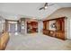 Open layout of living room and dining room with natural light at 16350 Timber Cove St, Hudson, CO 80642