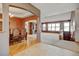 Open layout with carpeted living space and hardwood dining room with furniture at 16350 Timber Cove St, Hudson, CO 80642