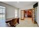Office space with large windows and glass doors to dining room at 16350 Timber Cove St, Hudson, CO 80642
