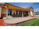 Covered patio with a brick base, offering ample space for outdoor seating and entertaining at 16350 Timber Cove St, Hudson, CO 80642