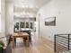 Bright dining room with hardwood floors and view to kitchen at 3897 Piney Grove St, Evergreen, CO 80439