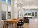 Bright dining area with wood table and view at 3897 Piney Grove St, Evergreen, CO 80439