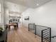 Open concept dining area with hardwood floors and modern light fixture at 3897 Piney Grove St, Evergreen, CO 80439