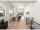 Open concept dining area with hardwood floors and kitchen views at 3897 Piney Grove St, Evergreen, CO 80439