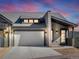 Modern mountain home exterior with attached garage and stone accents at 3897 Piney Grove St, Evergreen, CO 80439