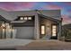 Modern two-car garage and front entry of mountain home at 3897 Piney Grove St, Evergreen, CO 80439