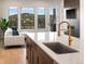 Modern kitchen with island and mountain view at 3897 Piney Grove St, Evergreen, CO 80439
