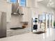 Modern kitchen with white cabinets and gold accents at 3897 Piney Grove St, Evergreen, CO 80439