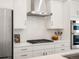 Modern kitchen with white cabinets and gold accents at 3897 Piney Grove St, Evergreen, CO 80439