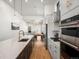 Open concept kitchen with island and stainless steel appliances at 3897 Piney Grove St, Evergreen, CO 80439