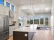 Modern kitchen with island and stainless steel appliances at 3897 Piney Grove St, Evergreen, CO 80439