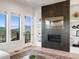 Bright living room features a fireplace, built-in shelving, and stunning mountain views at 3897 Piney Grove St, Evergreen, CO 80439