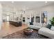 Open concept living room and kitchen with mountain views at 3897 Piney Grove St, Evergreen, CO 80439