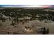 Expansive aerial view of property, showcasing the home, outbuildings, and surrounding landscape at 11840 Elkhorn Dr, Franktown, CO 80116