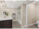 Elegant bathroom featuring a glass-enclosed shower and a modern vanity with stylish fixtures at 11840 Elkhorn Dr, Franktown, CO 80116