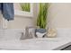 Elegant bathroom featuring a stylish sink, decor, and a well-lit mirror, enhancing the home's modern appeal at 11840 Elkhorn Dr, Franktown, CO 80116