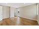 Spacious bedroom features wood flooring, a door to the outside and a closet enhancing the functionality of the home at 11840 Elkhorn Dr, Franktown, CO 80116
