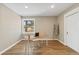Bright bedroom with hardwood floors, a desk next to the window, and a closet provides ample space at 11840 Elkhorn Dr, Franktown, CO 80116