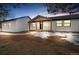 Inviting front porch on a home featuring white siding and black framed windows at 11840 Elkhorn Dr, Franktown, CO 80116