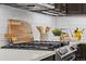 Close-up of kitchen showcasing gas range, tile backsplash and accessories at 11840 Elkhorn Dr, Franktown, CO 80116