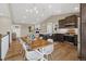 Spacious kitchen flows into the dining room and living room at 11840 Elkhorn Dr, Franktown, CO 80116