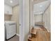 The laundry room features a modern washer and dryer, along with access to a hallway, providing convenience at 11840 Elkhorn Dr, Franktown, CO 80116