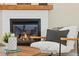 Cozy living room featuring a fireplace, comfortable seating, and stylish decor for relaxation and comfort at 11840 Elkhorn Dr, Franktown, CO 80116