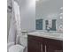 Bathroom with decorative shower curtain, neutral walls, a modern dark vanity and white countertop at 5538 Espana Ct, Denver, CO 80249
