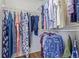 Walk-in closet with wire shelving and a variety of clothing items at 5538 Espana Ct, Denver, CO 80249