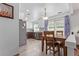 Bright dining area with backyard access and views into the kitchen at 5538 Espana Ct, Denver, CO 80249