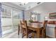 Bright dining area with backyard access and views into the living room at 5538 Espana Ct, Denver, CO 80249