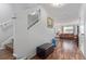 Inviting entryway with wood floors, staircase, and view into the living room at 5538 Espana Ct, Denver, CO 80249